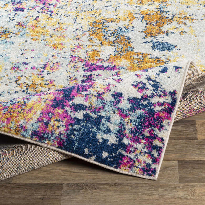 Close-up of the Fowlmere Area Rug, a colorful contemporary rug with aqua, pink, and saffron hues. Fold