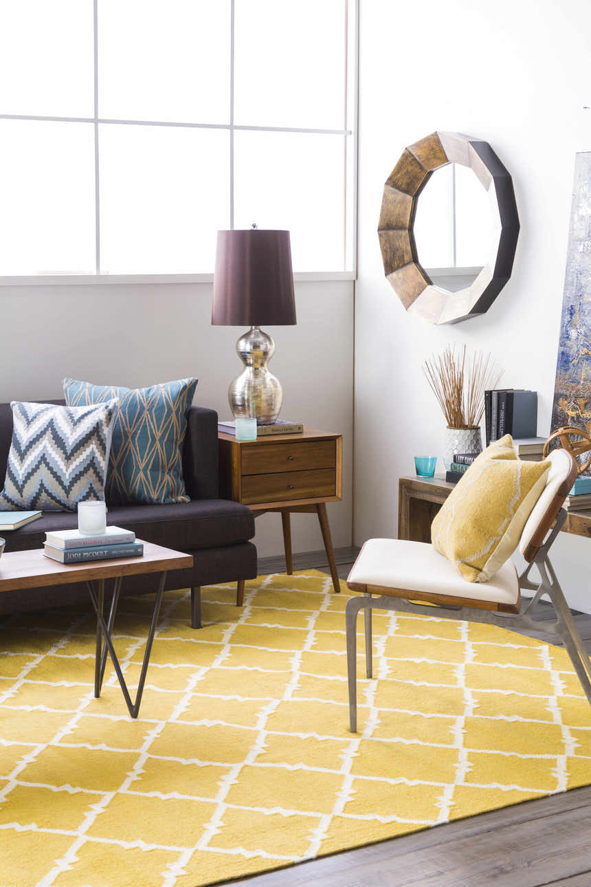 Living room scene with a mustard Bloomer Area Rug, gray sofa, and mid-century modern furniture. Roomscene-Rectangle