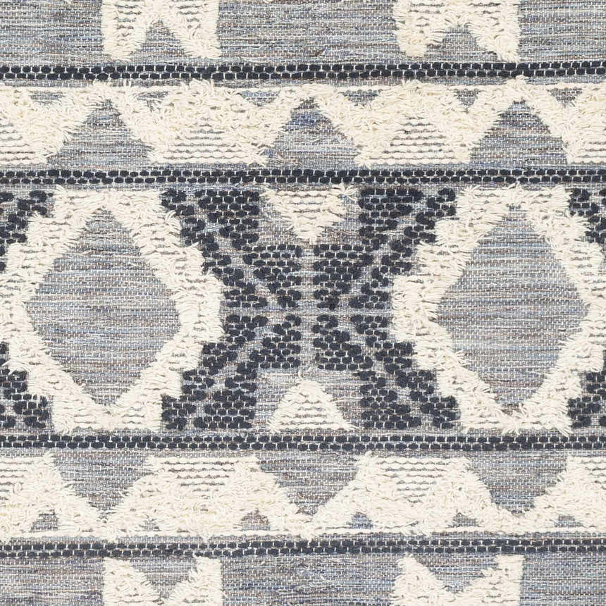 Close-up of Gakona High-Low Cream&Blue Wool Rug featuring a geometric pattern, textured details, and woven construction. Swatch