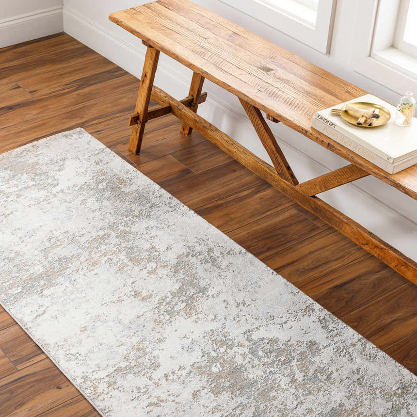 Entryway with a Ganit Thick Luxe Boutique Rug in beige, bone, and gray, paired with a rustic wooden bench. Roomscene-Runner