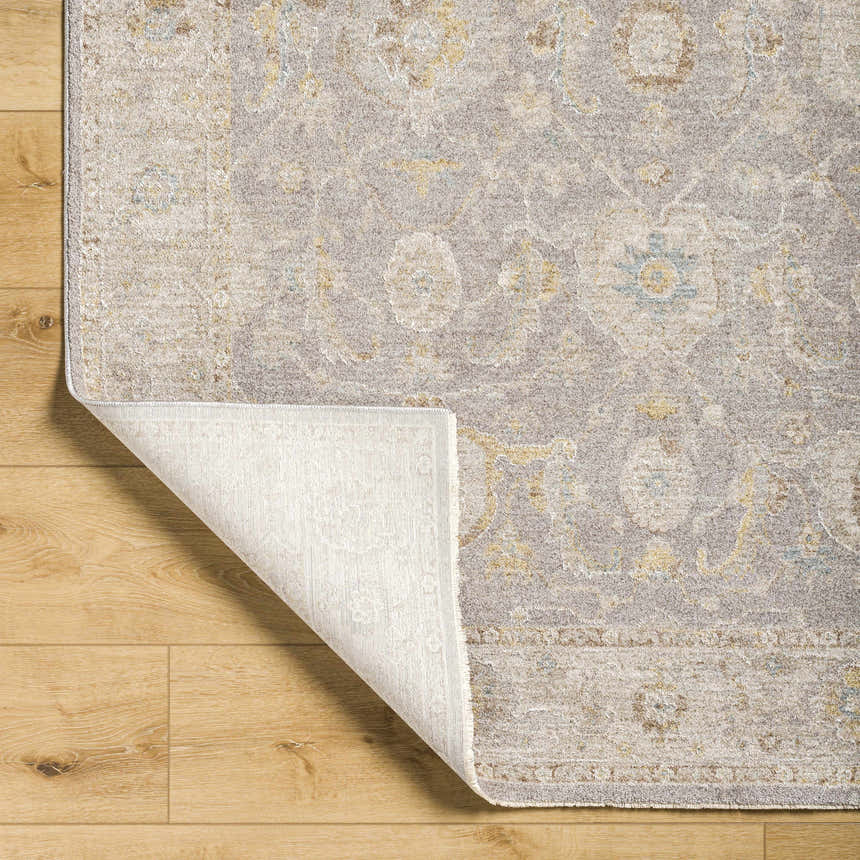 Close-up of the Giang Thick Luxe Area Rug in Beachhouse, showing its traditional pattern and soft texture. Fold
