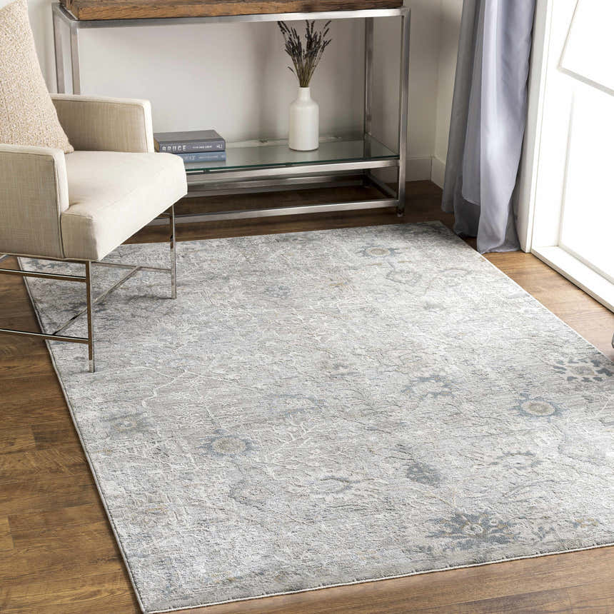 Living room scene with a Gilmanton Thick Luxe Boutique Rug in dusty sage and gray, under a chair and console table. Roomscene-Rectangle