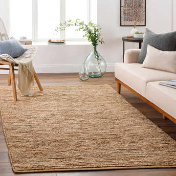 Living room scene with Glover Natural Braided Jute Carpet, cream sofa, and natural light. Farmhouse style. Roomscene-Rectangle