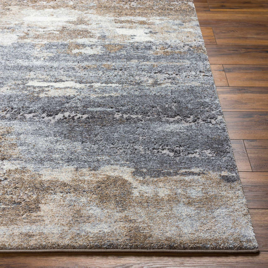 Close-up of Gonen Thick Luxe Rug showing gray, brown, and white abstract pattern and plush texture on wood floor. Front