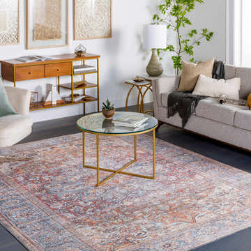 Living room scene with Rust Gardnertown Medallion Washable Area Rug, sofa, and gold coffee table. Bohemian style. Roomscene-Rectangle