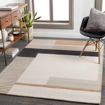 Modern living room scene with a geometric Gungahlin Area Rug in black, beige, and peach tones. Roomscene-Rectangle