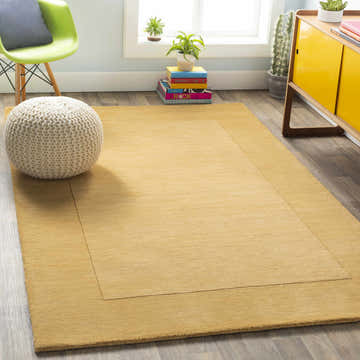 Bright living room with a Bordered Solid Camel Yellow Wool Rug, pouf, and yellow cabinet. Roomscene-Rectangle