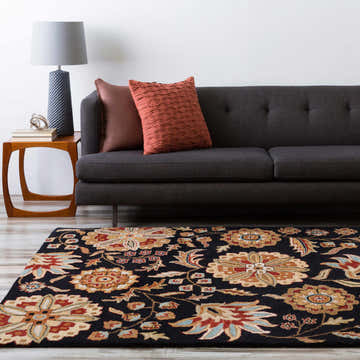 Living room scene with a black sofa, side table, and Heaters Black Floral Wool Carpet. Roomscene-Rectangle
