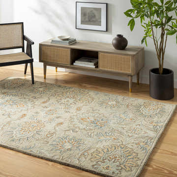Living room scene with a beige floral Hedia Area Rug, wood floors, and mid-century modern furniture. Roomscene-Rectangle