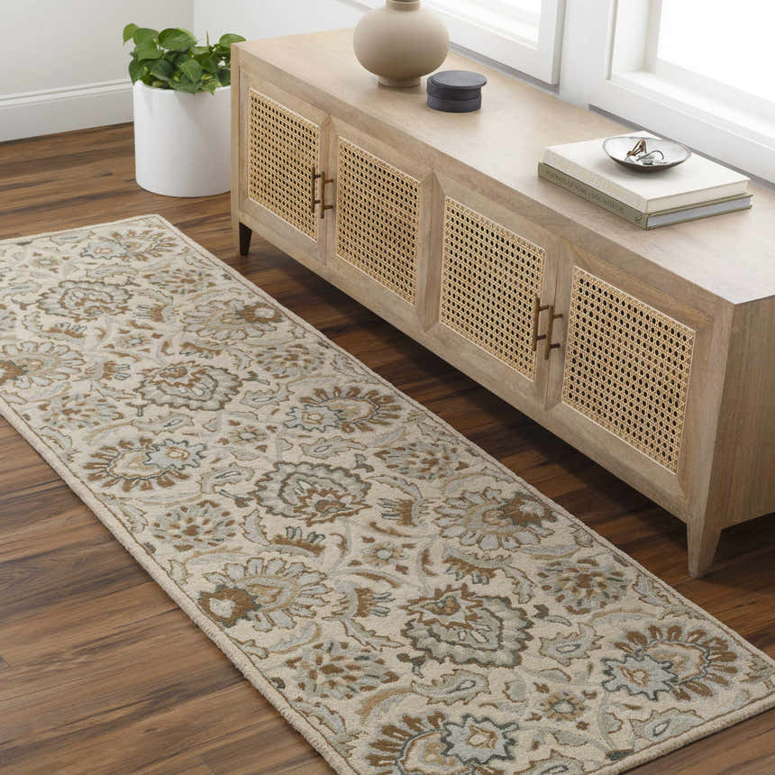 Entryway with beige Helia Area Rug runner, wood floors, and a light wood console table with cane detailing. Roomscene-Runner