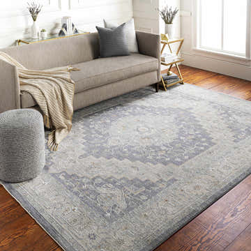 Living room with a Sema Blue Medallion Thick Luxe Area Rug, gray sofa, wood floors, and natural light. Roomscene-Rectangle