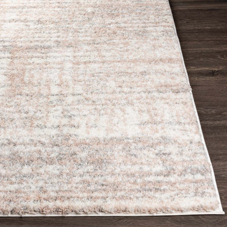 Close-up of a plush Hammond Dusty Pink Rug showing cream, pink, and gray tones with a soft shag texture. Front