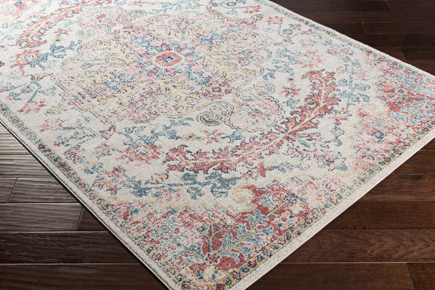 Close-up of the Hemingbrough Red&White Medallion Rug showing its red, blue, and saffron bohemian-style design. Corner