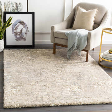 Living room scene with a Holtsville Abstract Ivory Thick Rug, gray chair, gold side table, and modern art. Roomscene-Rectangle
