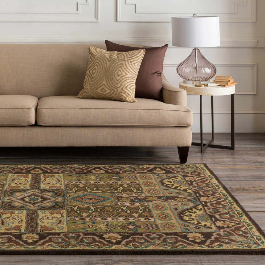 Living room scene with the beige Huguenot 12x15 wool rug, tan sofa, brown pillows, and side table with lamp. Farmhouse style decor. Roomscene-Rectangle