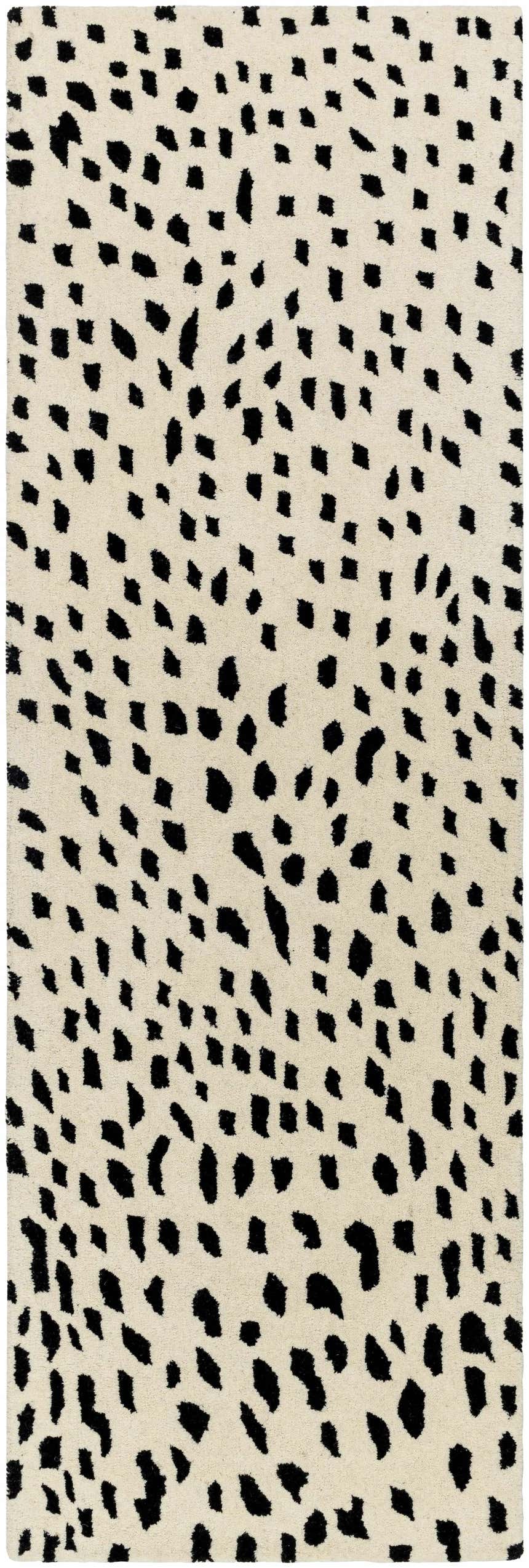 Close-up of the Athena White Giraffe Print Wool Rug, featuring a black animal print design on an off-white, hand-tufted wool texture. Design-Runner-268