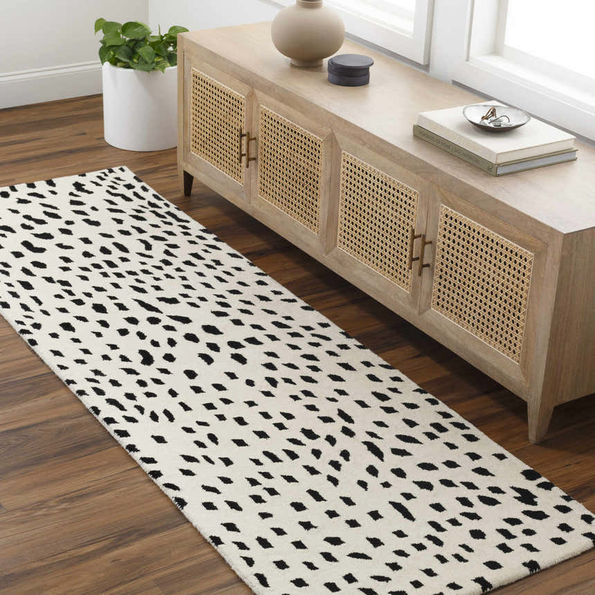 Entryway with Athena White Giraffe Print Wool Rug, wood console table, and plant. Contemporary style. Roomscene-Runner