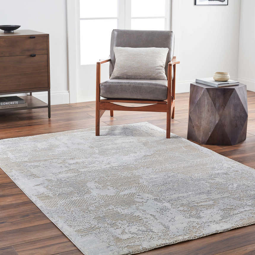 Living room scene with gray Indah Thick Luxe Area Rug, wood chair, and mid-century modern dresser. Roomscene-Rectangle