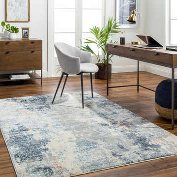 Home office with wood desk, gray chair, and Iryna Area Rug in charcoal, brown, gray, and nutmeg. Contemporary style. Roomscene-Rectangle