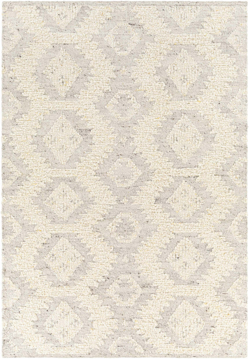 Close-up of the hand woven Jagupit Area Rug. Brown, cream, and light gray wool rug with a bohemian diamond pattern. Design-Rectangle-576