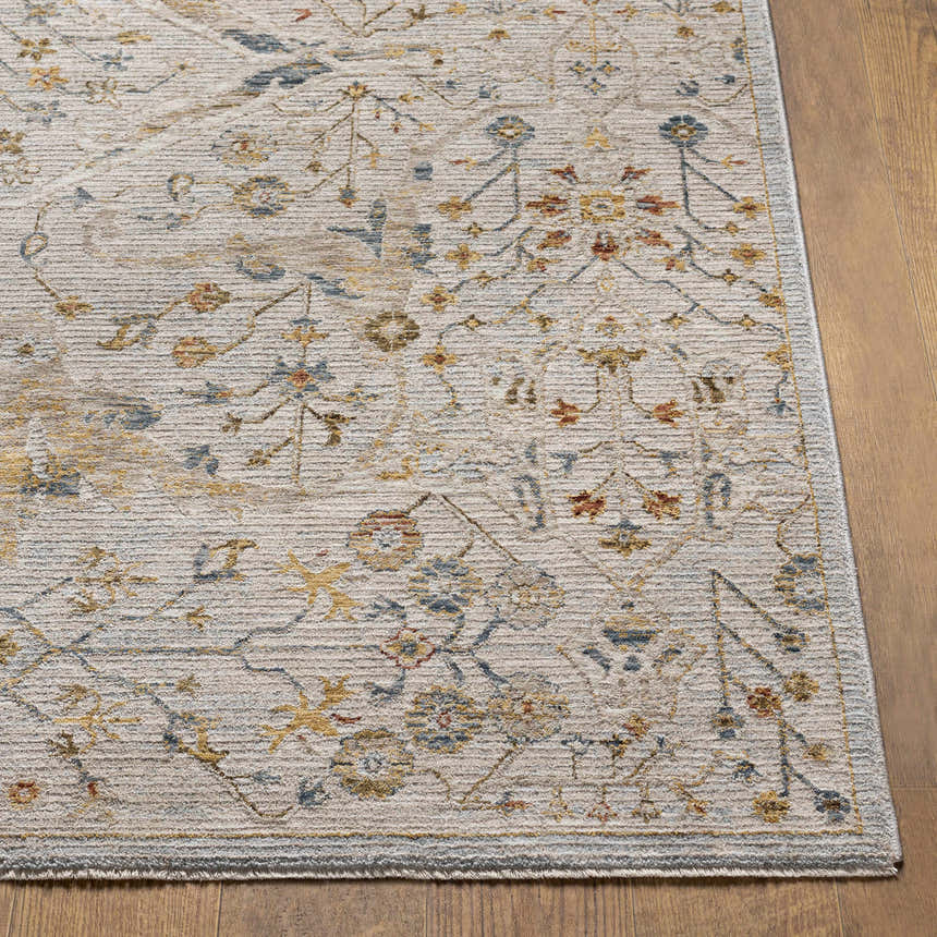 Close-up of the Kabungahan Oushak Style Floral Rug. Cream rug with brick red, denim, and mustard floral pattern. Front