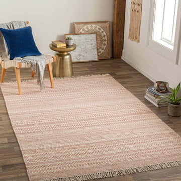 Living room scene with Kalinga Red/Cream Flatweave Wool Rug, chair with blue pillow, gold side table, and neutral wall decor. Roomscene-Rectangle