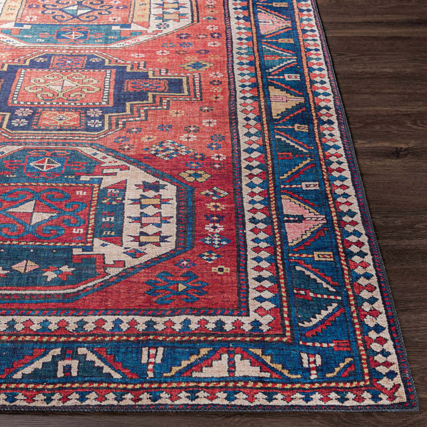 Close-up of the Kodiak Red&Blue Oriental Area Rug. Traditional design with red, blue, and beige tones on dark wood floor. Front