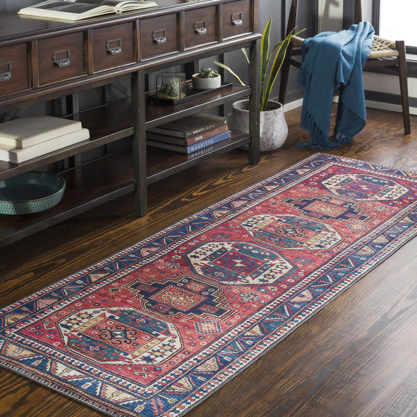 Entryway with a Kodiak Red&Blue Oriental Area Rug runner, dark wood console table, and blue throw blanket. Roomscene-Runner
