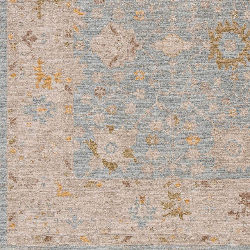 Close-up of the Kofi Thick Luxe Area Rug, showcasing its traditional floral pattern and luxe texture in amber, taupe, and light blue. Swatch