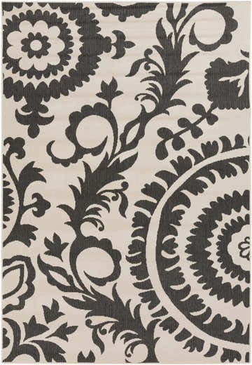 Close-up of the Kongiganak Area Rug. Black floral and paisley pattern on a light beige Olefin rug. Design-Rectangle-5376