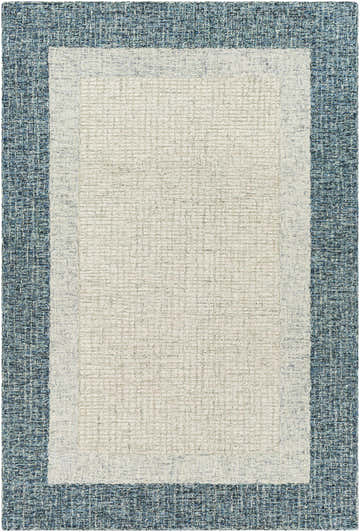 Close-up of the hand-tufted Kuruman Area Rug. Cream center with a textured light and medium gray and teal border. Design-Rectangle-576