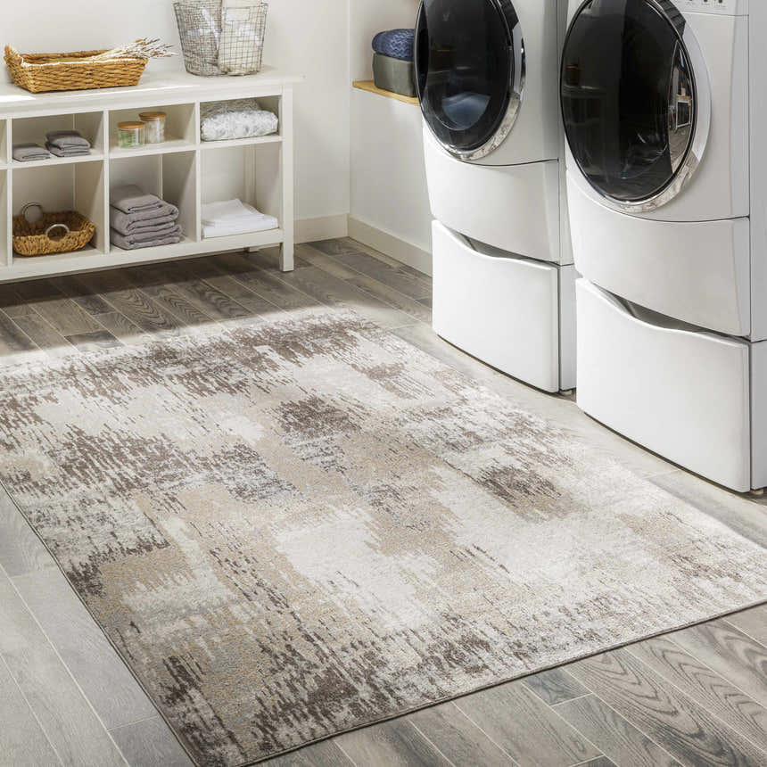Laundry room with white washer/dryer and Kuyucak Washable Area Rug in brown, cream, and beige on gray wood-look tile. Roomscene-Rectangle