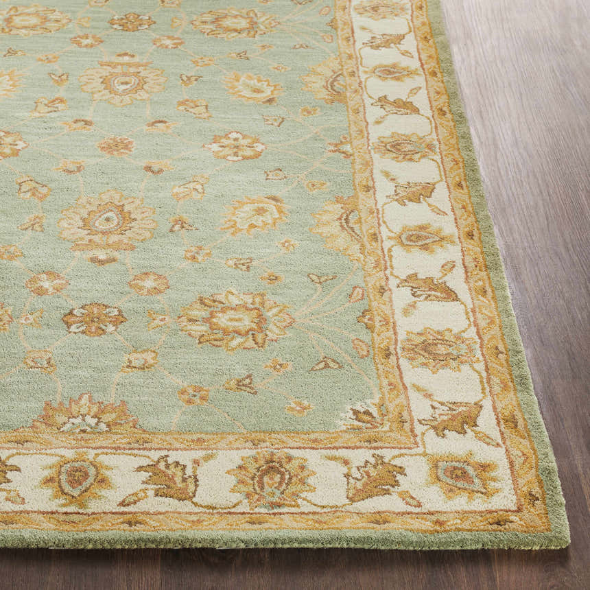 Close-up of the hand-tufted Lagrange Sage Regency Wool Carpet with a floral pattern in sage, beige, and brown tones. Front