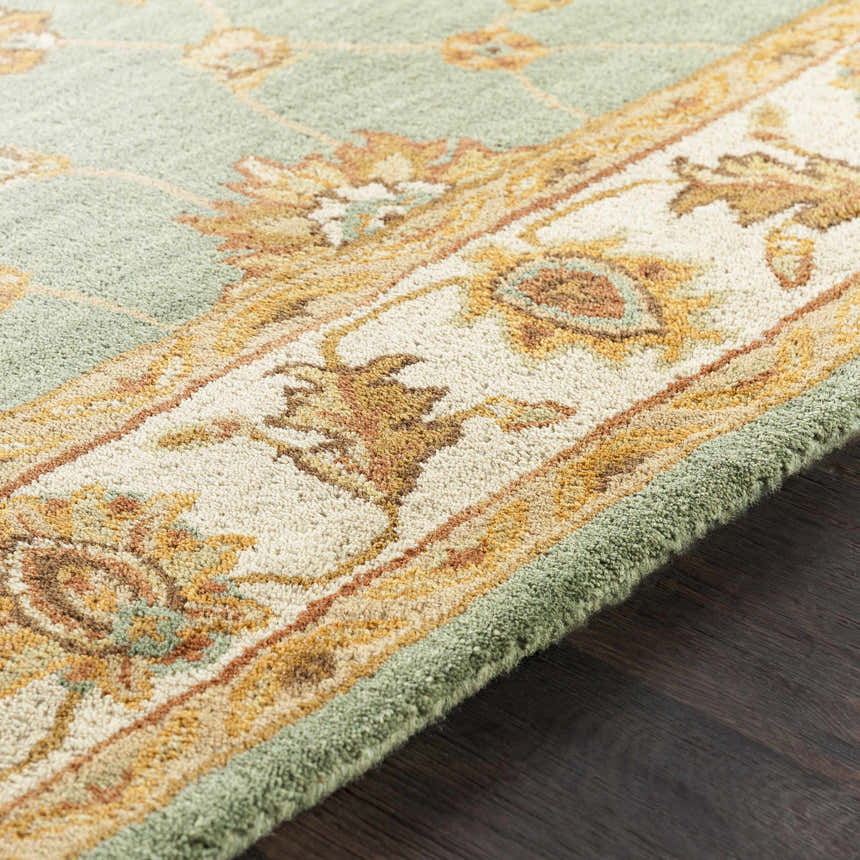 Close up of the Lagrange Sage Regency Wool Carpet showing sage, beige, and brown floral pattern and wool texture. Texture