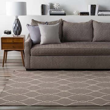 Living room scene with gray sofa and Lamy Beige Trellis Wool Rug. Contemporary style, light beige and gray tones. Roomscene-Rectangle