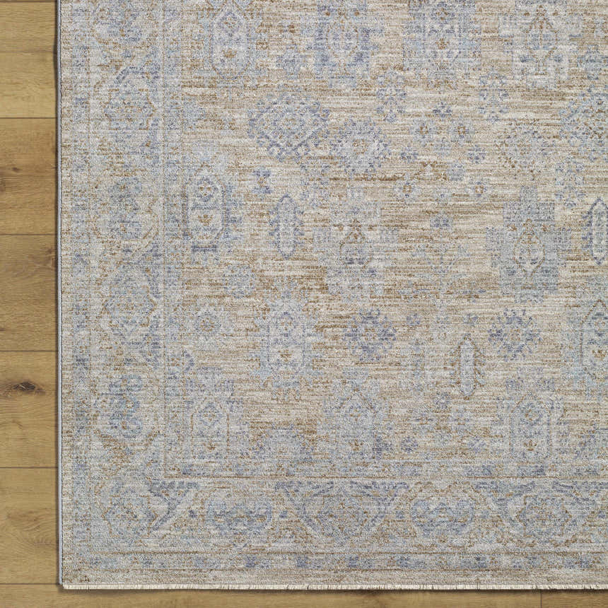 Close-up of Coby Cream Avant Garde rug showing traditional oriental design, brown, dusty sage and gray colors, and luxe texture. Corner