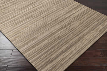 Close up of the Elberton Area Rug showing its tan, light, and dark brown striped pattern. Corner