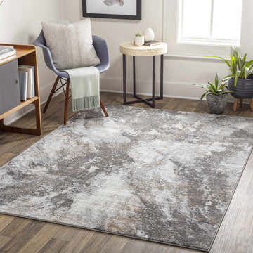 Living room scene with Leganes Brown Marble Rug, gray chair, wood side table, and potted plants. Roomscene-Rectangle