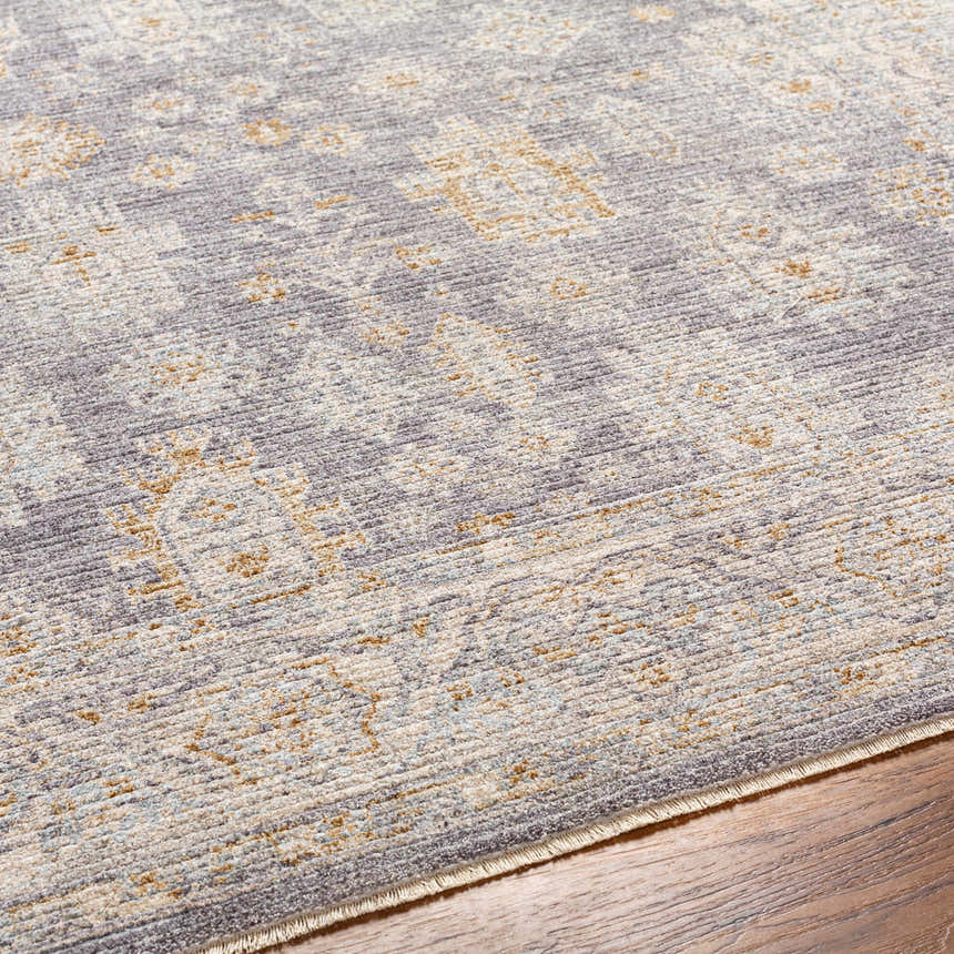 Close-up of the Coby Brown Avant Garde rug. Luxe texture with brown, charcoal, sage, gray, and teal oriental-inspired pattern. Texture