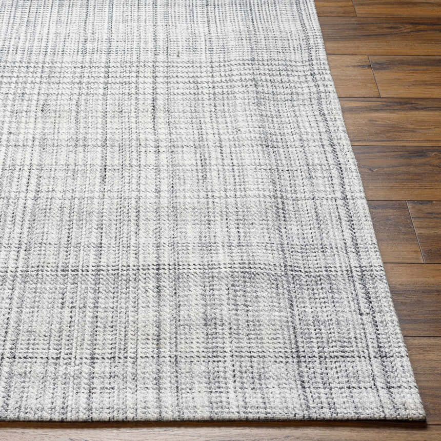 Close up of Lubna Light Slate Area Rug showing woven texture and subtle black and charcoal plaid pattern. Front