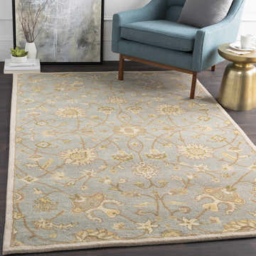 Living room scene with a Logville Hand Tufted Light Olive rug, blue chair, gold accent table, and neutral wall art. Roomscene-Rectangle