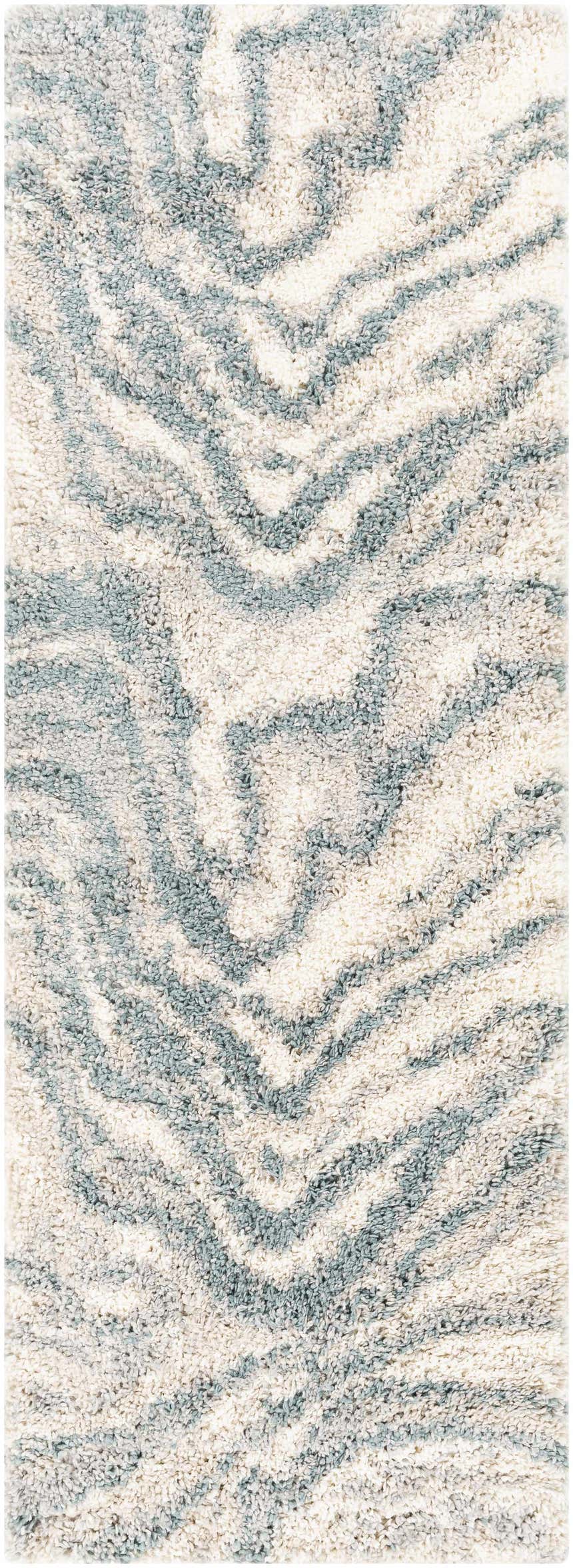 Close up of the Lottery Area Rug. Shag rug with a blue, cream, and light beige wavy pattern. Design-Runner-2773