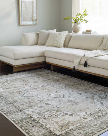 Living room scene with a Lotan Sage Medallion Washable Area Rug under a cream sectional sofa. Neutral tones, light and airy. Roomscene-Rectangle