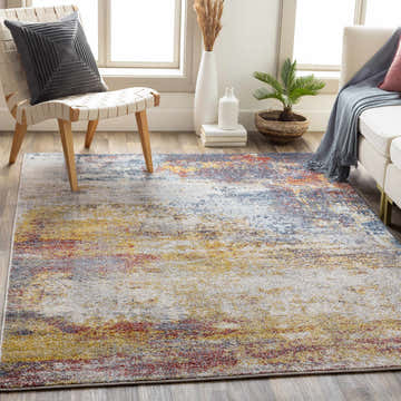 Living room scene with a cream sofa and the colorful Alexandra Area Rug in brick red, charcoal, mustard, and gray. Roomscene-Rectangle