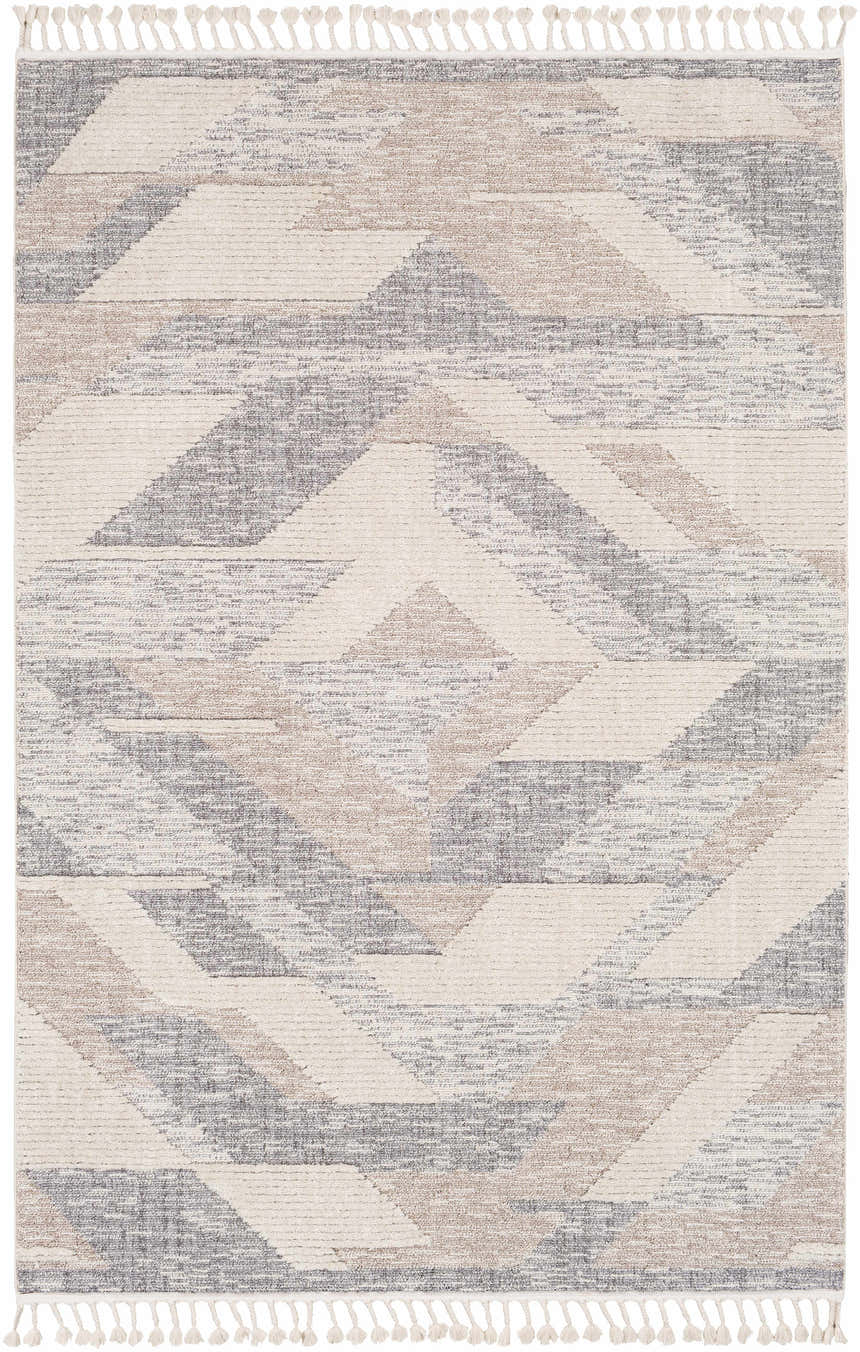 Close-up of the Magazine Geometric High/Low Pile Rug. Gray, tan, and cream diamond pattern with tassels. Design-Rectangle-5373