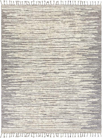 Close-up of the hand-knotted Mahaffey Area Rug. Charcoal, cream, and gray wool rug with a contemporary stripe pattern and tassels. Design-Rectangle-810