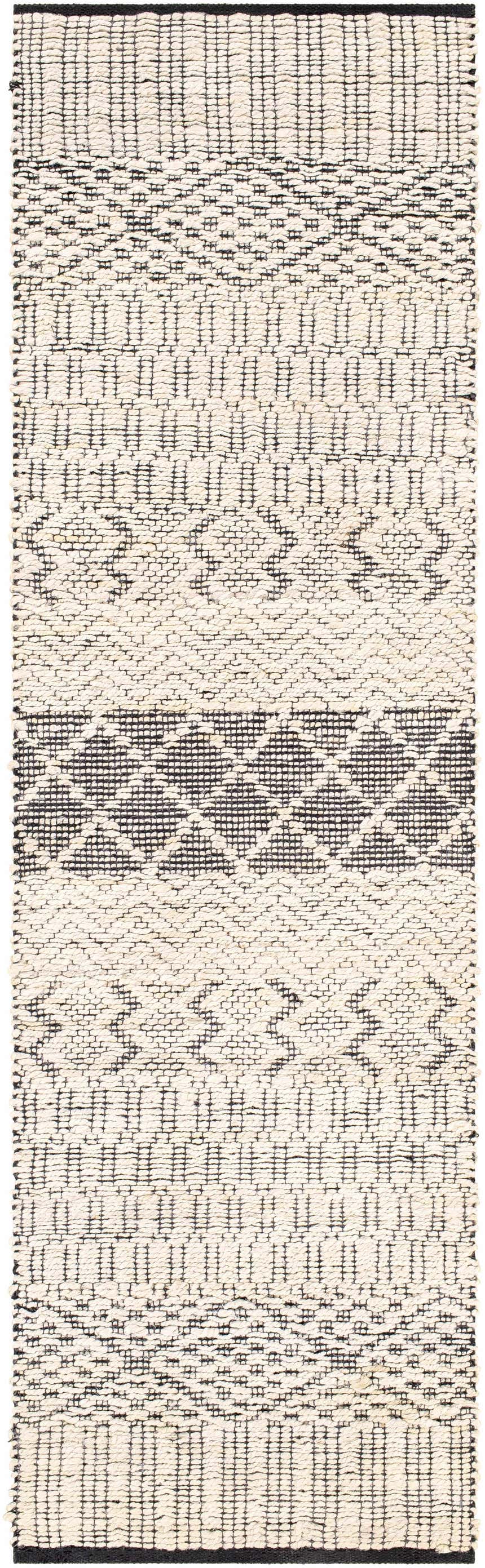 Close-up of the hand woven Malolos Jute Carpet. Black and cream geometric pattern. Bohemian, farmhouse style rug. Design-Runner-268