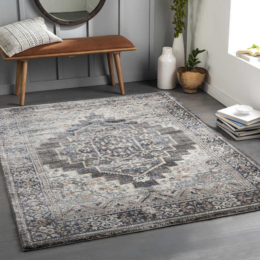 Entryway with a brown bench and the gray, blue, and cream Manaring Luxe Thick Area Rug. Roomscene-Rectangle