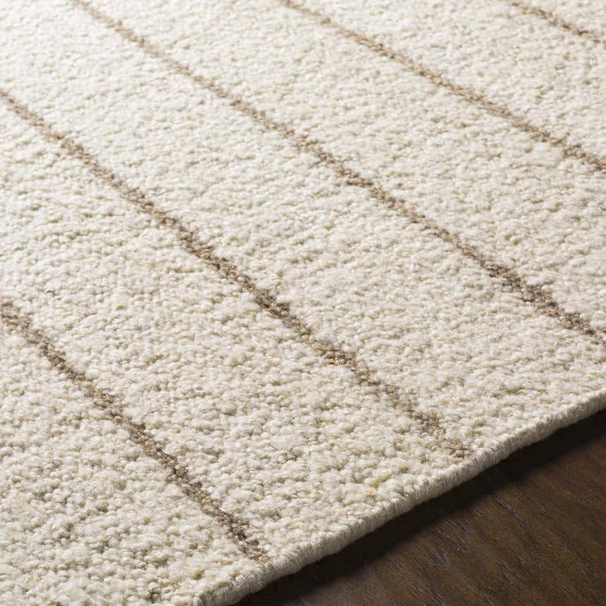 Close-up of the hand woven Matawan Premium Wool Rug in ivory with taupe stripes, showcasing its texture. Texture