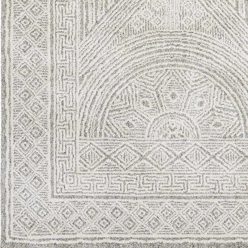 Close up of the Middleville Luxe Rug, a contemporary rug in charcoal, cream, and gray with geometric patterns. Swatch
